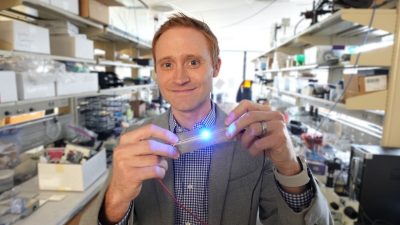 Michael Bartlett holds a flexible circuit in his lab.