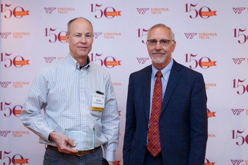 Kevin Kochersberger receives the Alumni Award for Excellence for International Outreach from Virginia Tech Provost Cyril Clarke. 