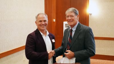 (From left) Department Head Brian Lattimer presents Douglas Rabe with a gift at his induction into the Mechanical Engineering Society of Distinguished Alumni. Photo by Alex Parrish for Virginia Tech.