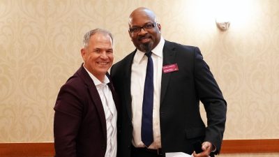 (From left) Department Head Brian Lattimer presents Darrell Roberts with a gift at his induction into the Mechanical Engineering Society of Distinguished Alumni. Photo by Alex Parrish for Virginia Tech.