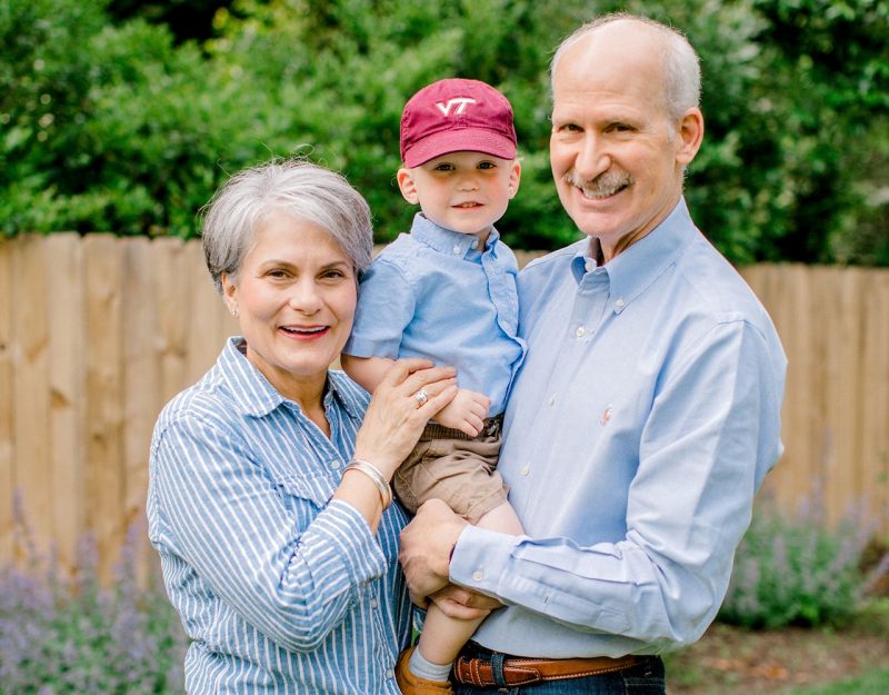 Hokie family Marianne and Jim '80 Young with their grandson, Max Garbett.