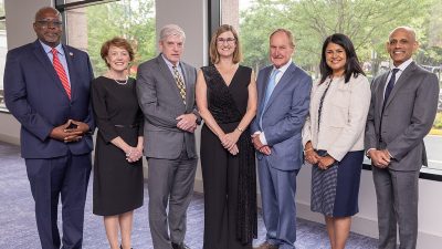 All six 2024 Academy inductees stand with Dean Julie Ross.