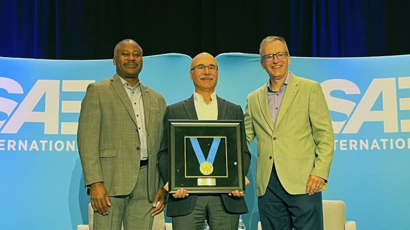 (From left) Audley Brown, Vice President of the Commercial Vehicle Sector of the Society of Automotive Engineers (SAE), presents the Medal of Honor to Mehdi Ahmadian with Gregory L. Bradley, Interim SAE CEO and Chief Legal Officer. Photo courtesy of SAE.