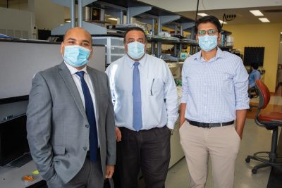 Anuj Karpatne, Amrinder Nain, and Sohan Kale are standing in the STEP Lab.